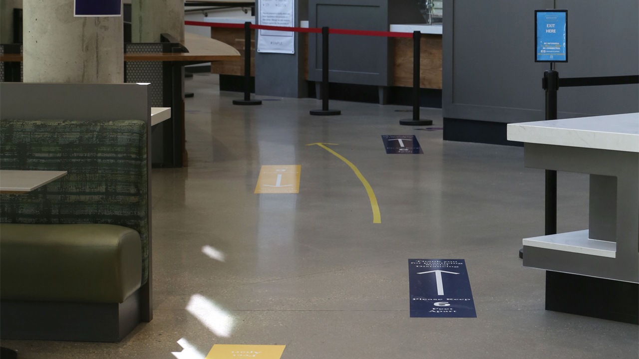 Markings on the floor of The Commons residence hall at Marquette University reinforce social distancing.