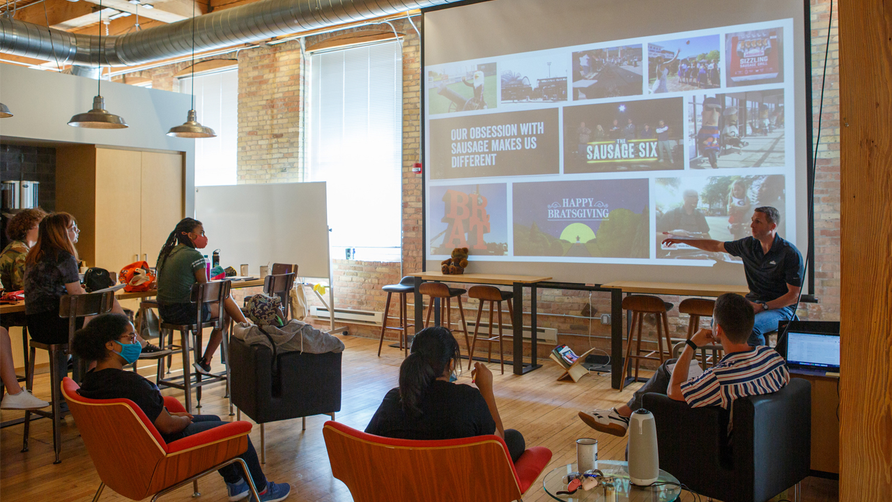 Jamie Schmelzer of Johnsonville gives a presentation of his company to the student interns.