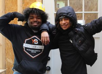Two members of Milwaukee Christian Center's current YouthBuild cohort pose for a photo while they work on building two homes in the Muskego Way Neighborhood on the south side of Milwaukee. Photo submitted by the Milwaukee Christian Center.