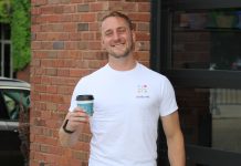 Brad Steckart stands outside of Wantable Cafe, a partner of Sit By Me.