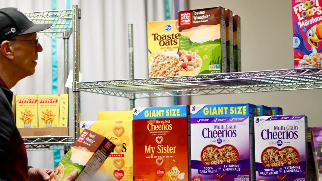 Boxes of cereal and other dry goods line the shelves of Hunger Task Force’s Jim Luther New Hope Center food pantry on Milwaukee’s south side.