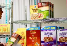 Boxes of cereal and other dry goods line the shelves of Hunger Task Force’s Jim Luther New Hope Center food pantry on Milwaukee’s south side.