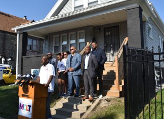 Lamont Davis, executive director Milwaukee Community Land Trust, speaks at an event on Monday, July 14 outside a renovated home on the south side of Milwaukee.