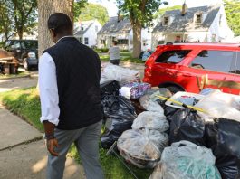Milwaukee County Executive David Crowley examining storm damage early last week.