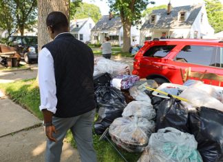 Milwaukee County Executive David Crowley examining storm damage early last week.