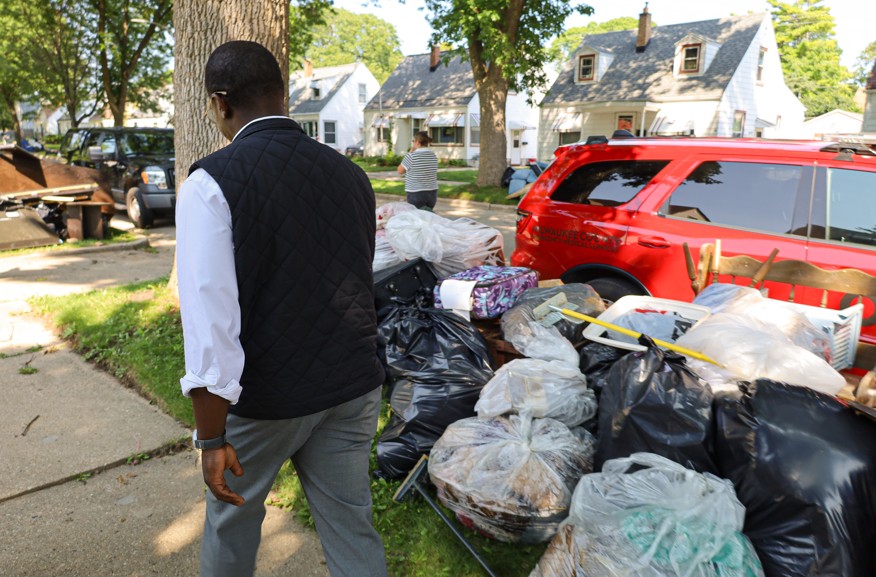Milwaukee County Executive David Crowley examining storm damage early last week.