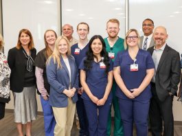 Surgical technologist apprentices – pictured here with DWD Secretary Amy Pechacek, program participants and employer sponsors – at their August orientation at UW Health in Madison.