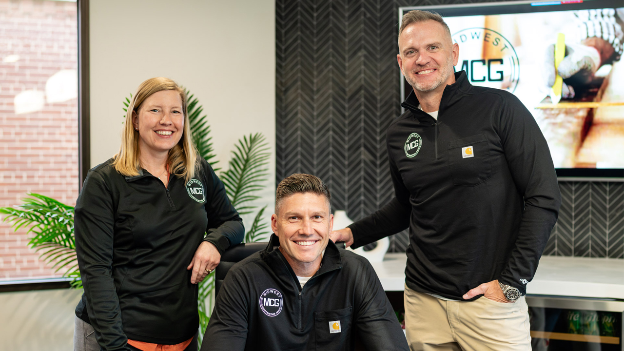 Midwest Construction Group leadership: (left to right) director of client services Tracy Wallschlaeger, vice president Brigham Green and president Sean Bailey.