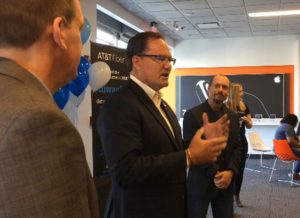 AT&T Wisconsin state president Scott VanderSanden announces the AT&T Fiber launch with Steve Baas (left) of the Metropolitan Milwaukee Association of Commerce and David Ven Roy, AT&T Wisconsin director of sales.