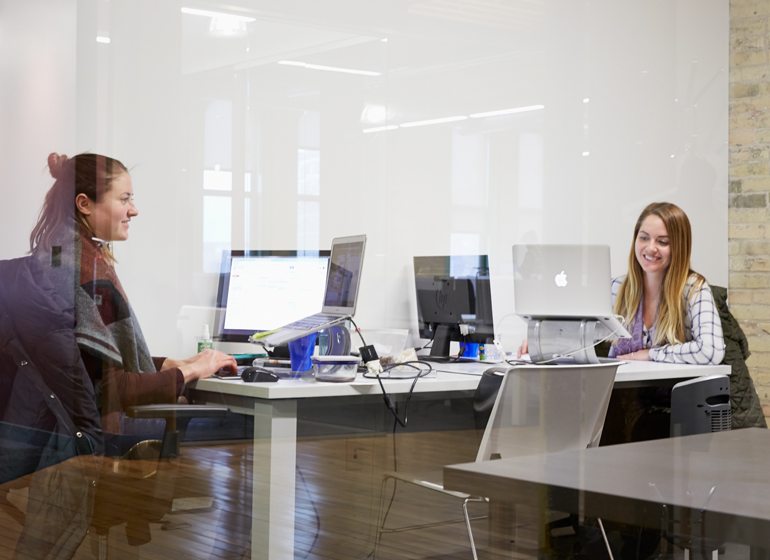 Krista Bergan and Marisa Raymonds of Chicago-based OfficeLuv work in a private office space at Ward4.