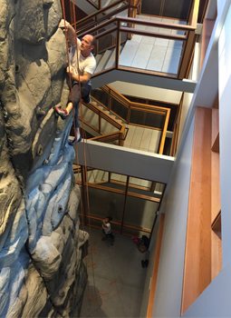 Acuity installed a climbing wall in its Sheboygan headquarters as a perk to help with employee retention.