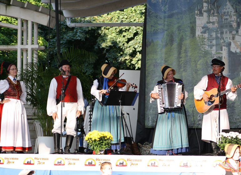 George Radtke, far right, and Liesl Thomas, second from right, play with Pommersche Tanzdeel Freistadt at Milwaukee’s German Fest. 