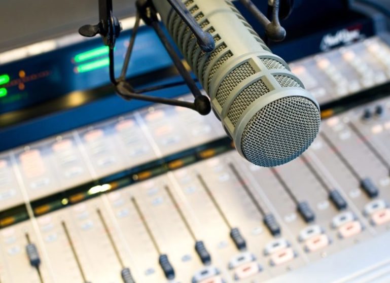 Radio station-126910409-shutterstock Radio microphone and mixer