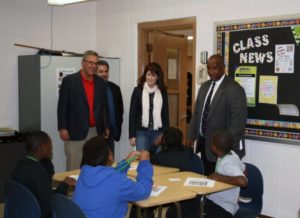 WHEDA chief operating officer Brian Schimming, Lt. Gov. Rebecca Kleefisch and Operation Dream founder Rodney Bourrage tour an Operation WORK classroom on Saturday at Barack Obama School of Career and Technical Education in Milwaukee.