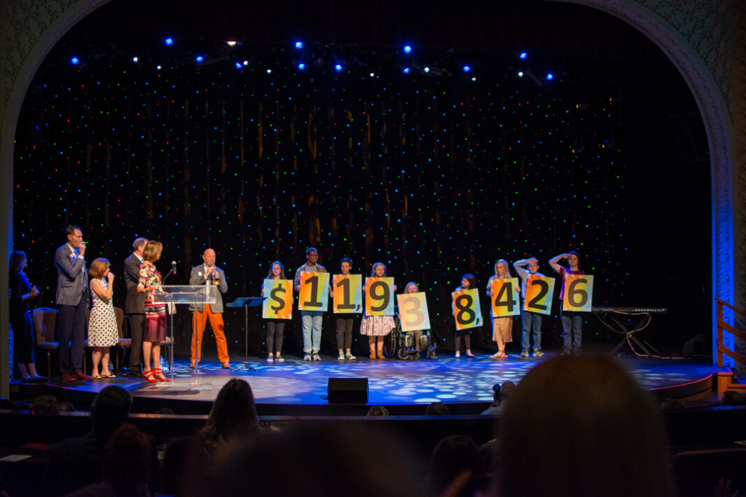 Reveal of 2019 UPAF fundraising total. (Photo: UPAF)