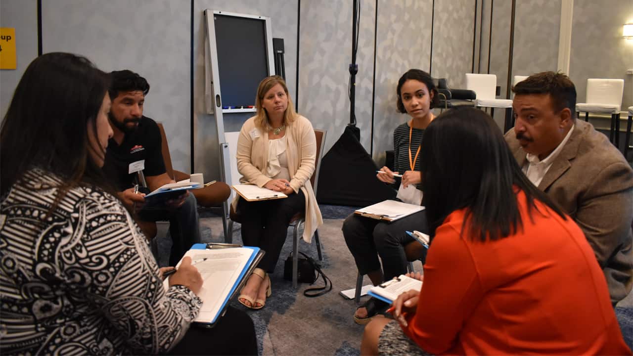 A breakout group discusses solutions for increasing prosperity among Hispanic workers in the region during a recent Hispanic Collaborative community working group meeting. 