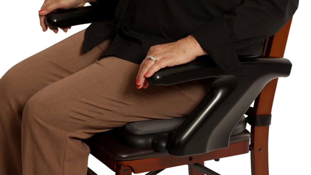 The EZ-Sit attaches to most chairs.